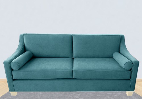 Μοντέρνος καναπές σε χρώμα πετρόλ άνετος και διαχρονικός